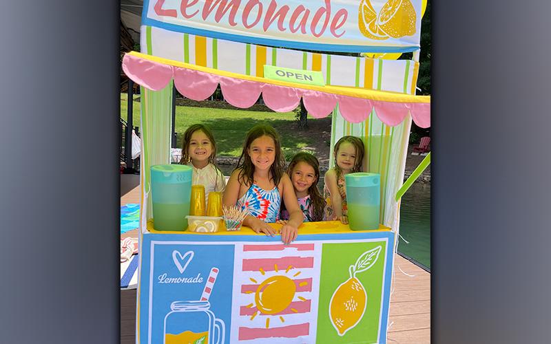 Sloane Sanchez, Olivia Sanchez, Lucy Sanchez and Emilia Eckles, from left, recently raised $200 to donate to St. Jude’s Children’s Hospital by serving lemonade off Mark and Nancy Staley’s, Eckles’ grandparents, boat dock in Morganton. “The girls’ mothers used the experience as a teaching moment about charity and what it means to help others,” Staley said.