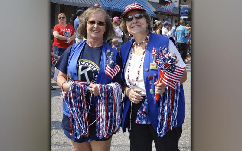 Blue Ridge Kiwanians Becky Callihan, left, and Sherry Morris stop passing out necklaces for a quick photo during the Old Timers’ Parade. The event was held Saturday morning, July 3, in downtown Blue Ridge as the annual celebration of America’s Independence kicked off. The parade was sponsored by the Blue Ridge Business Association. Don’t miss next week’s edition of The News Observer for more pictures from the parade and many other celebration activities.