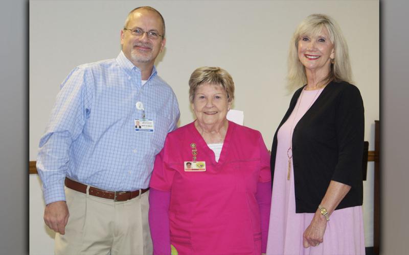 Wanda Patterson, middle, was honored during the Fannin Regional Hospital Auxiliary organizational meeting Thursday, July 15. Showing their thanks are hospital CFO Geoff Blomeley and hospital Director of Volunteer Services Susan Kiker.