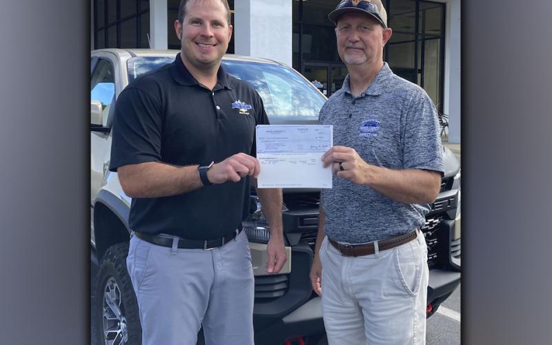 Bill Holt Chevrolet partnered with Chevy Youth Baseball and Softball and donated $1,000, as well as extra equipment, to the Fannin County Recreation Deptarment baseball and softball programs. Bill Holt employee Dewey Cardd is shown giving a check to Fannin recreation department Director Eddie O’Neal.