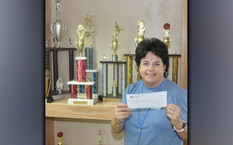 Lorraine Panter is shown with a donation to the Fannin County Recreation Department that was given from the Atlanta Hawks and Georgia Recreation and Parks Association. The $1,750 donation went to helping the kids in the Summer Camp program and was used to go to movies, waterparks, bowling and other activities.