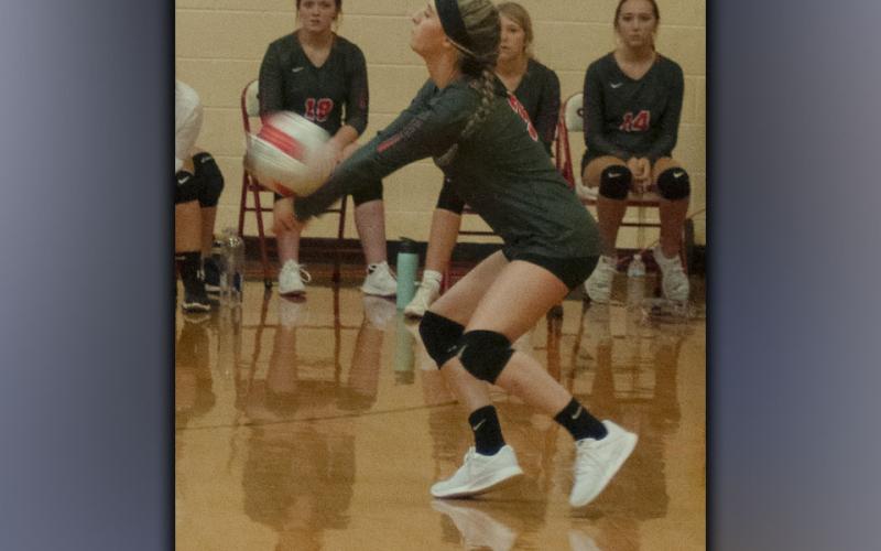 Gracie Smith makes a dig to keep the volley going after a spike from the Lady Patriots during the Lady Cougars game against Chattanooga School for the Arts and Sciences Thursday, August 19.