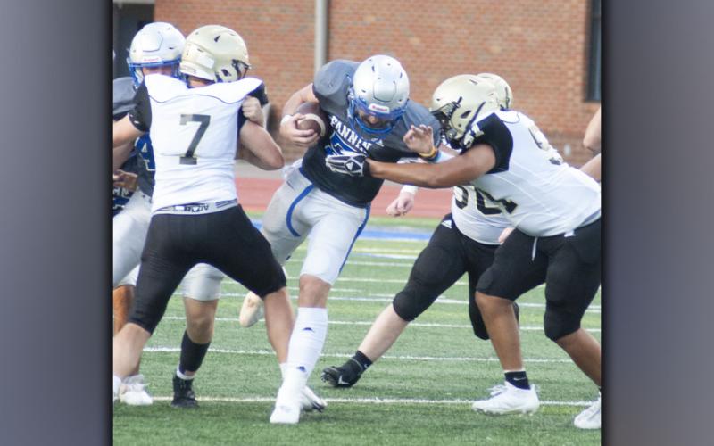 Seth Reece fights through the Yellow Jacket offensive line for a nice run during the Rebels scrimmage against Hayesville Friday, August 13.