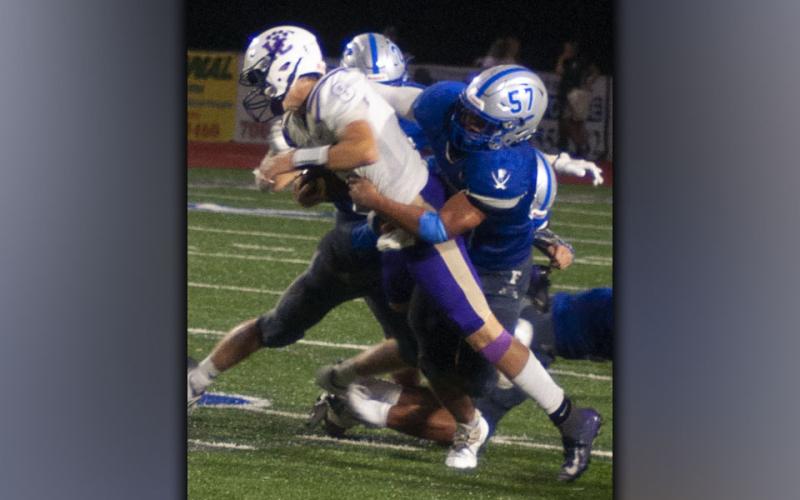 Ricardo Arellanes (57) brings down the Union County ball carrier during the Rebels 34-7 win over the Panthers Friday, August 20. Arellanes gave the Panthers problems on defense all night.