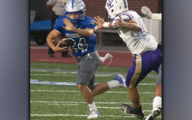 Khole Green (24) finds an opening for a gain during the Rebels win against Union County Friday, August 20.