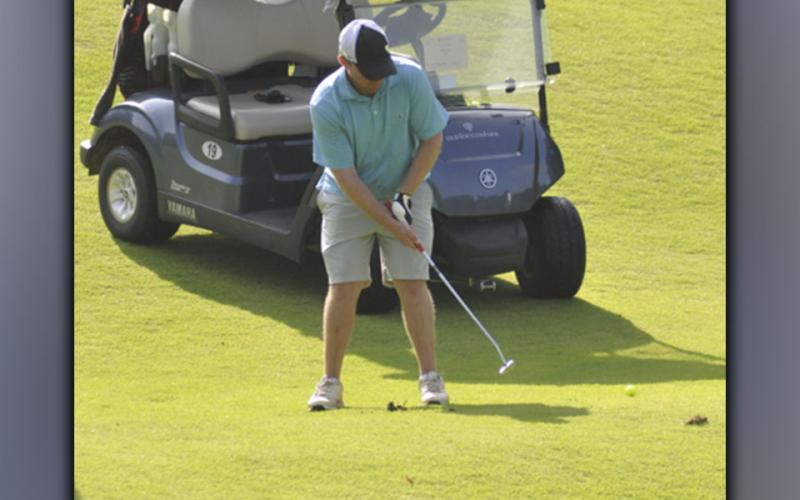Matthew Johnson pushes the ball to the green during the Fannin County Football Golf Tournament Tuesday, July 27.