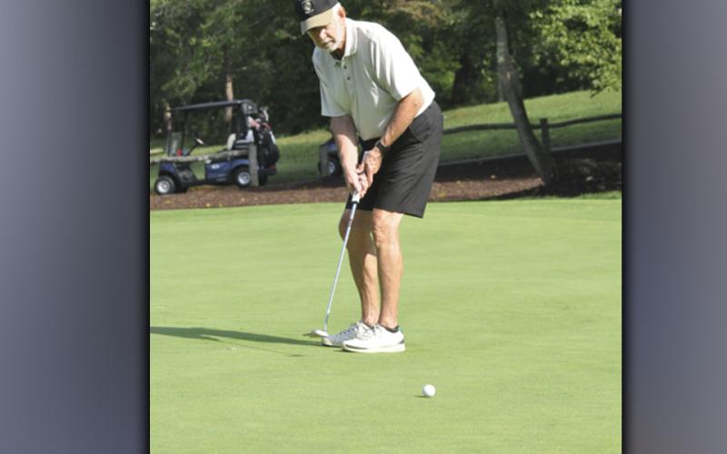 Ralph Kahlan eyes his putt during the Fannin County Football Golf Tournament Tuesday, July 27.Ralph Kahlan eyes his putt during the Fannin County Football Golf Tournament Tuesday, July 27.