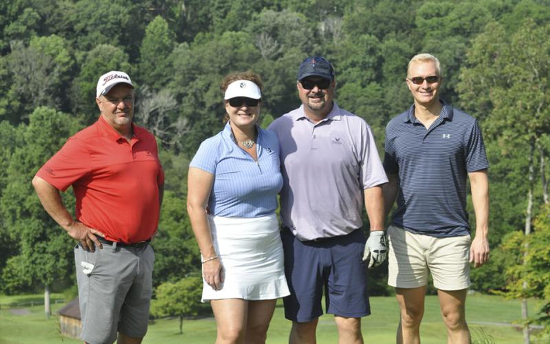 Golfers take a break from the heat and smile for a photo during Fannin County Football’s Golf Tournament Tuesday, July 27. Shown are, from left, Tyke Prince, Allison Sosebee, Billy Thompson and Frank Wood.
