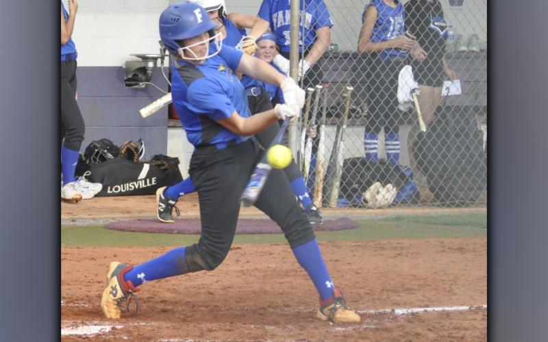 Josilynn Newton unloads on a ball in recent action for the Fannin County Lady Rebel softball team.