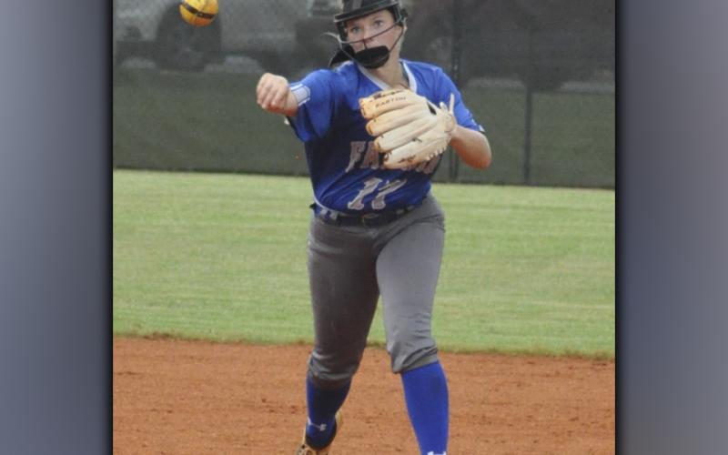 Riley Davis throws a runner out at first during the Lady Rebels win against Chestatee Wednesday, August 25.
