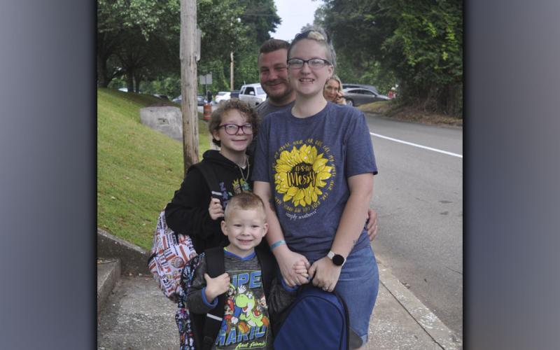 Shown being dropped off at the first day of school at Blue Ridge Elementary School Friday, July 30, are, clockwise, kindergartener Maclee Dillard, his sister fifth grader Keira Dillard, and parents Brett and Katie Dillard.