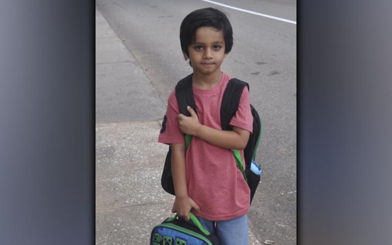 Kindergartener Ibrahim Khen pauses for a picture on the first day of school at Blue Ridge Elementary School Friday, July 30.