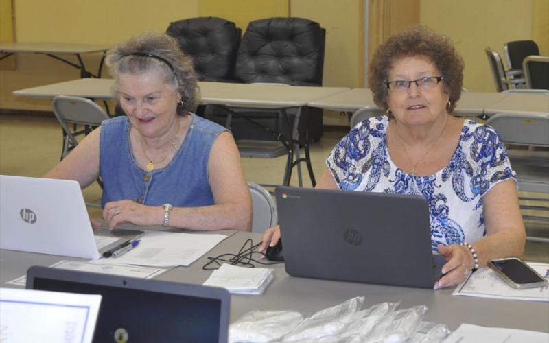 Beverly Whitmer, left, and Marieda Trammell keep working hard on their computer skills after completing the computer training at Copper Basin Community Center Friday, August 13.