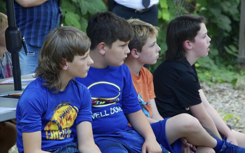 Blue Ridge Elementary School fifth grade students Chance Headrick, Brantley Merrill, Tristan Bernier and Peyton Anderson, from left, listen attentively during a special Flag Etiquette class given by the North Georgia Honor Guard.