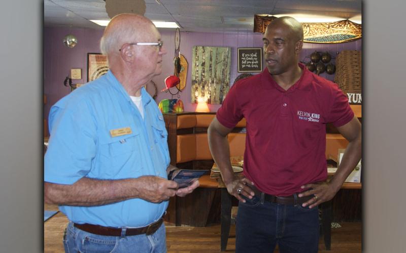 Kelvin King, right, who is challenging Senator Raphael Warnock in next year’s election, made a stop at Mystic Mountain Pizza in Blue Ridge Saturday, August 14, and is shown talking about his campaign with John Jenkins.