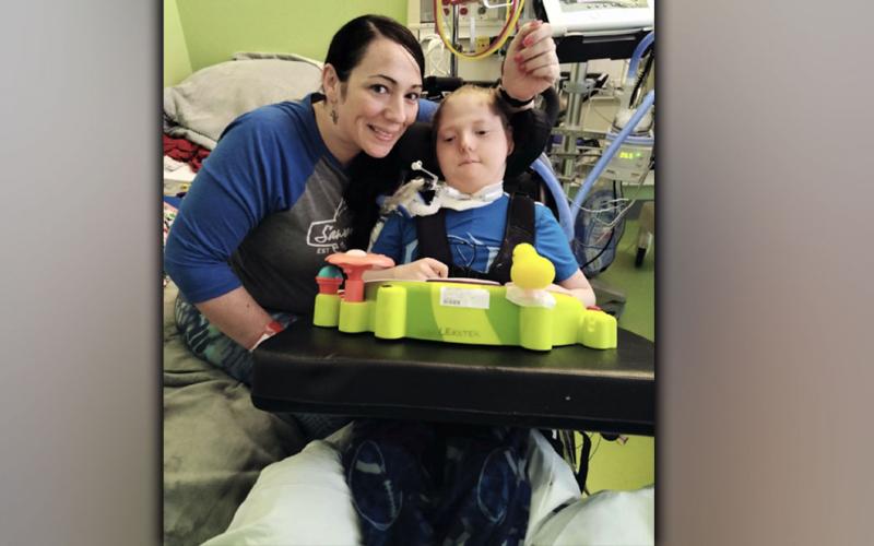 Laura Thorton and Joshua smile for a photo while in the hospital. Joshua Thorton recently spent 75 days in the hospital after undergoing a tracheotomy.