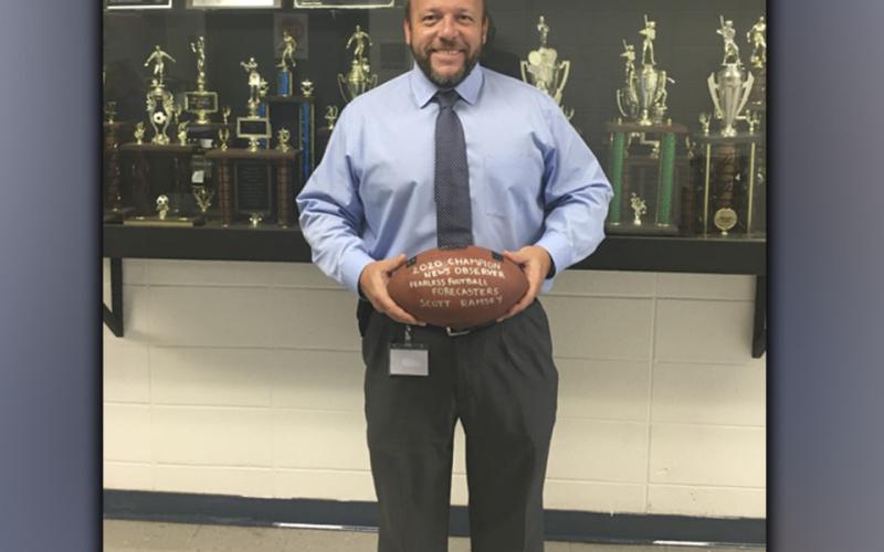 Fannin County High School principal Scott Ramsey shows off his 2020 News Observer Fearless Football Forcasters football he received for beating all other forcasters in last years football contest. Ramsey hopes to be crowned champion again this season.