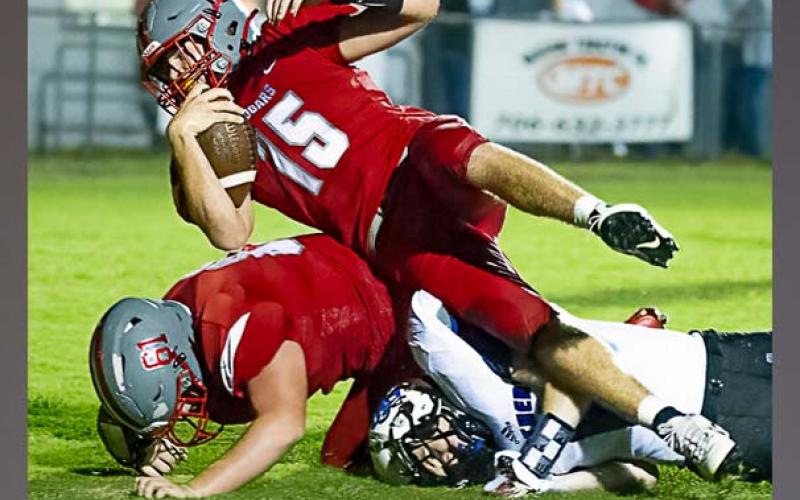 Photo courtesy All Star Photos // Copper Basin senior Joe Boggs fights for yardage against Sale Creek Friday night. Boggs rushed for 63 yards and threw for 170 in the game.