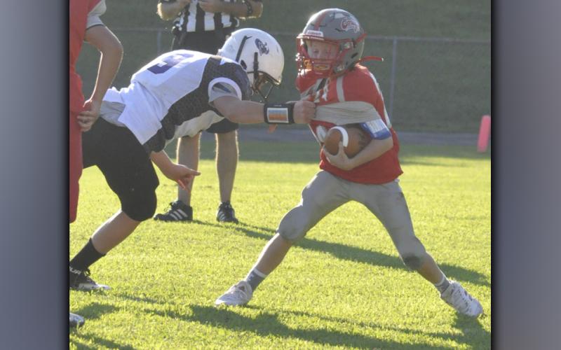 Cougar Tucker Rhodes gets an interception and shimmies past a defender during Copper Basin’s Middle School game against Bradley County Thursday, September 2.