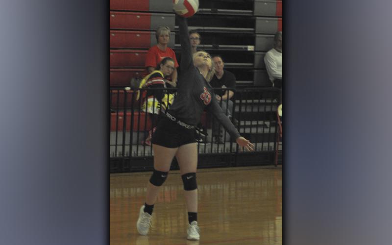 Channing Beach serves the ball during the Lady Cougars volleyball game against Meigs County Tuesday, September 7.