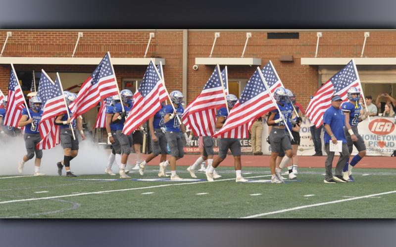 The Fannin County Rebels had a patriotic entrance in their game against Southeast Whitfield Friday, September 10. All the players came out with American flags to start the game.