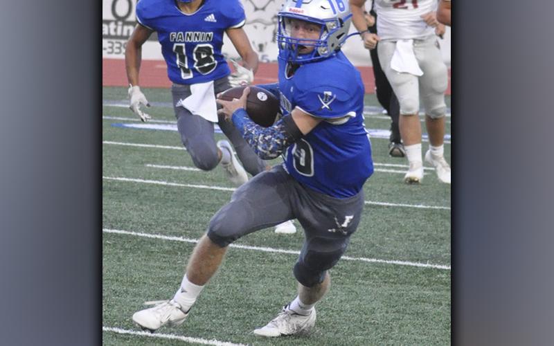 Carson Collis (16) hauls in a pass and fights for extra yards during the Rebels 35-6 win over the Southeast Whitfield Raiders Friday, September 10.