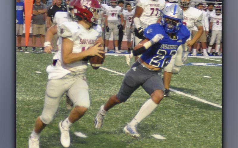 Cason Owensby (22) puts pressure on the quarterback and forces him to roll out in recent action for the Fannin County Rebel football team.