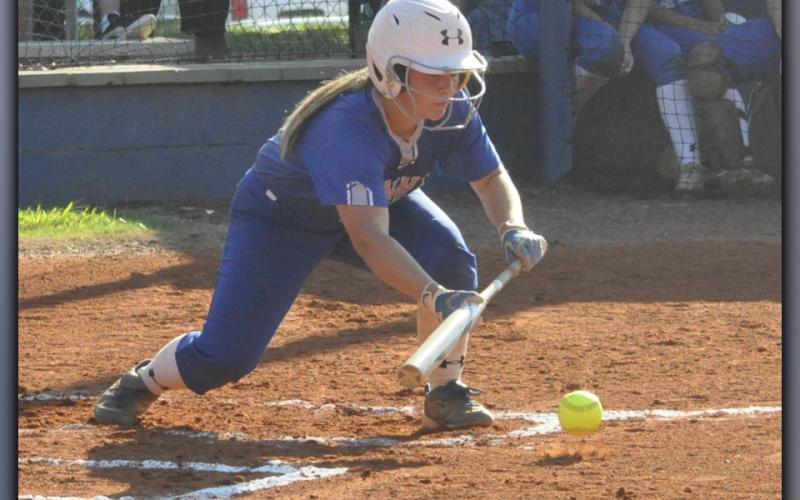 Zoe Putnam lays down a bunt during the Lady Rebels softball game against Union County Thursday, September 2.