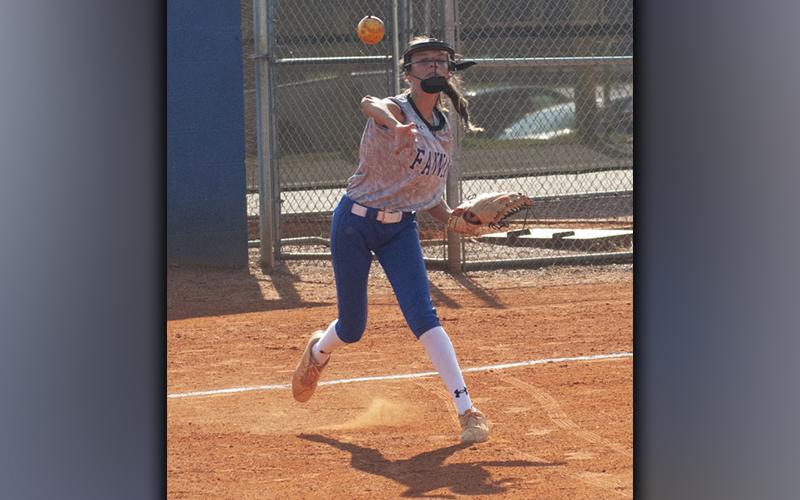 Aaleyah Rogers tries to throw a runner out in recent action for the Lady Rebel softball team.