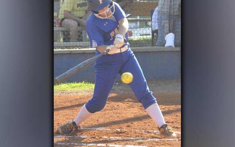 Riley Davis unloads on a ball in recent action for the Lady Rebels softball team.