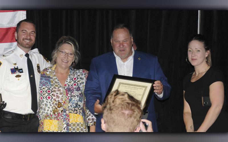 Mike Galinski, third from left, received a special Award of Appreciation from the Governor’s Office of Highway Safety for his efforts to help bring the traffic enforcement Quad Network Banquet to McCaysville last week. Also shown are, from left, McCaysville Police Chief Mike Earley, who presented the award, and Karen Hawkins and Emily Hawkins who manage Galinski’s restaurants and music venue in McCaysville.