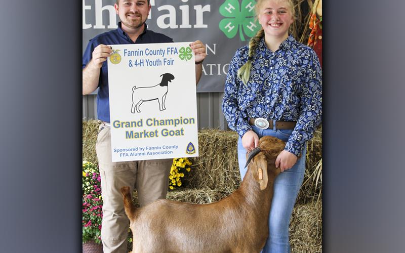 FFA High School member Samantha Adkins and her goat, Athena, won Grand Champion Market Goat at the FFA Youth Fair Saturday, September 18. Samantha also won first place in Market Goat weight class 1 and first place in Intermediate Market Goat showmanship. She is shown with FFA Middle School advisor Seth Davis.