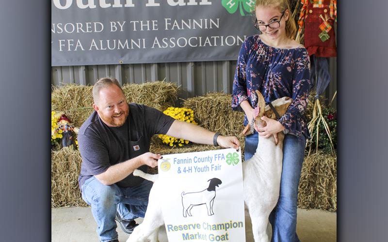 FFA High School member Claire Wheeler, and her goat, Toby Keith, won Reserve Champion Market Goat at the FFA Youth Fair September 18. Claire also won second place senior Market Goat Showmanship and first place Market Goats weight class 2. She is shown with her father, David Mathis.