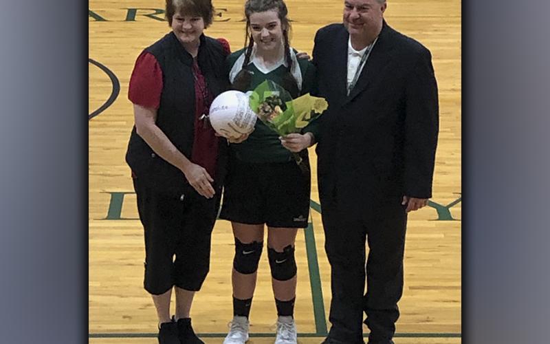 MACA volleyball seniors were recently honored during a Lady Lions volleyball game Thursday, September 23. Senior Caroline Scoggins was one of the three seniors honored and she is shown with her parents Chris and DeGina Scoggins.