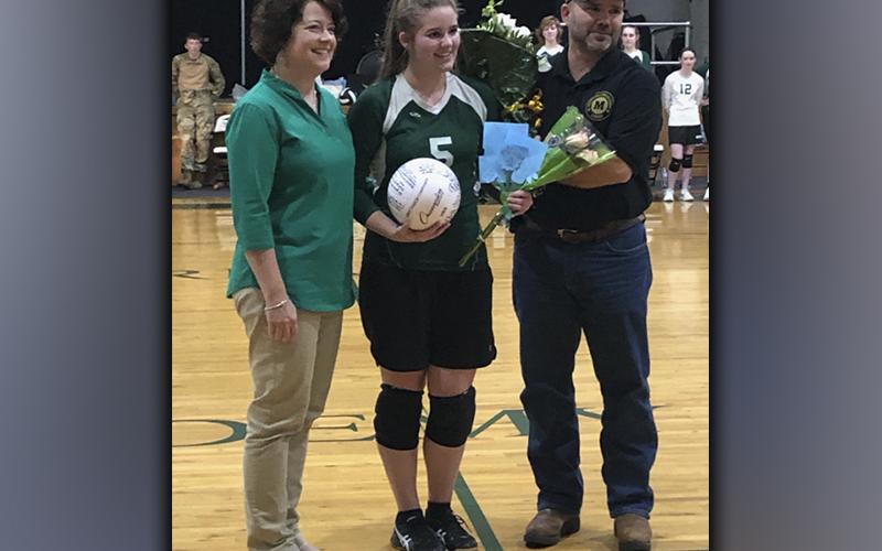 MACA recognized three seniors during the last home volleyball game of the season Thursday, September 23. Senior Emma Thomas is shown with her parents Andy and Laura Thomas.