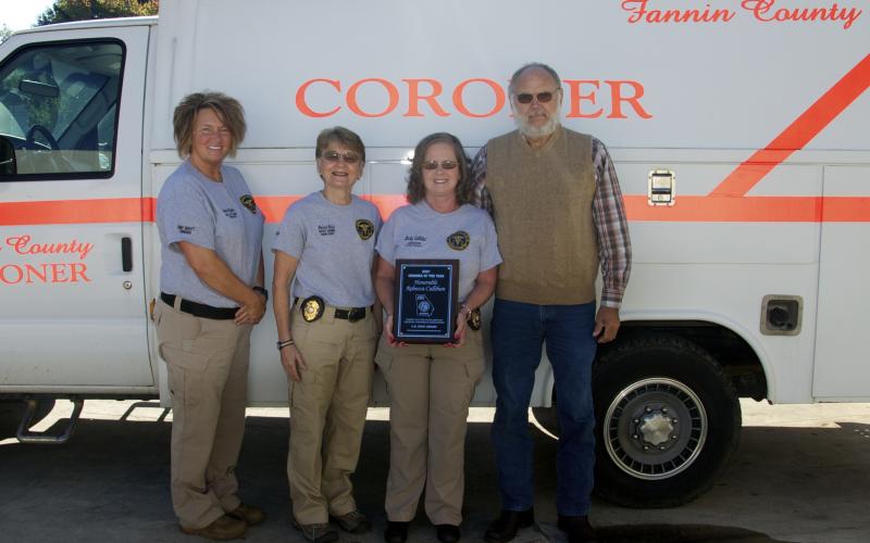 Fannin County Coroner Becky Callihan was honored by the Georgia Corners Association with the A.R. King Award, which recognizes outstanding public servants. Only one such award is presented each year. She is shown holding her plaque alongside deputy coroners Rebecca Hughson and Felicia Folds and her husband, Don Callihan.