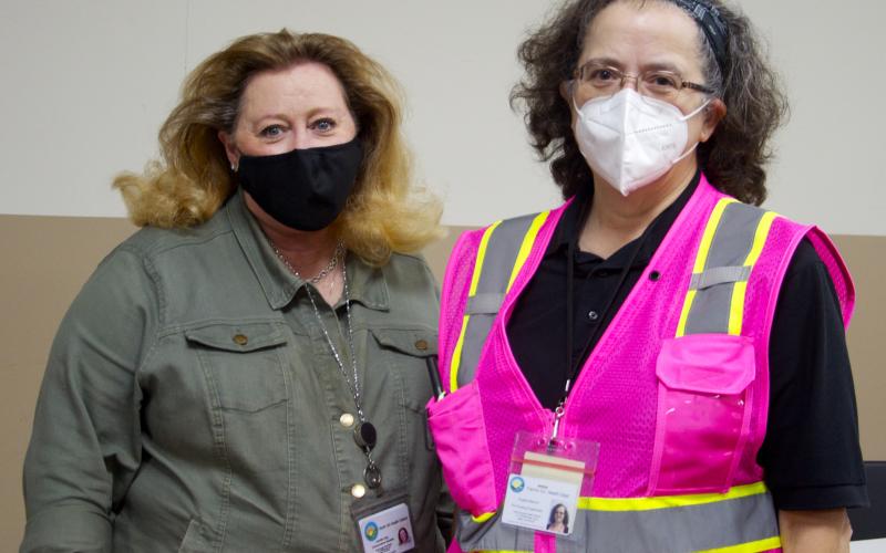 North Georgia Health District Communications Specialist Jennifer King, left, and Fannin County Health Department Nursing Supervisor Angela Blevins wait for individuals to get the COVID-19 vaccine during the health department’s COVID-19 Vaccination Clinic at the Kiwanis Club of Blue Ridge fairgrounds Saturday, September 18.