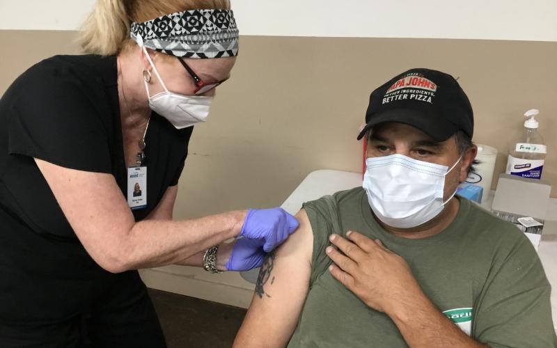 Fannin County resident Wilson Moss was the only person to take advantage of Fannin County Health Department’s COVID-19 Vaccination Clinic at the Kiwanis Club of Blue Ridge fairgrounds Saturday, September 18. Administering the shot is Becky Estes.