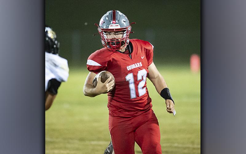 Photo by Allstar photos Sebastian Baliles (12) picks up some of his 180 rushing yards in the Cougars’ 46-25 win over Lookout Valley, Friday, October 1.