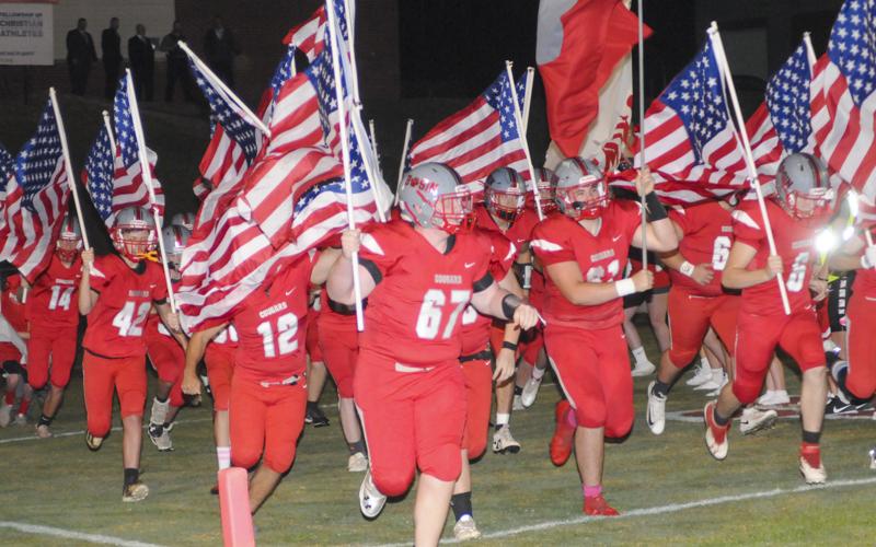 The Copper Basin Cougar football team recently had a patriotic entrance to their football game. Shown with American flags are, from left, (14) Tucker Rhodes, (42) Carder Lance, (12) Sebastian  Baliles, (67) Tucker Shroth, (61) Addison Hook and (6) Eli White.