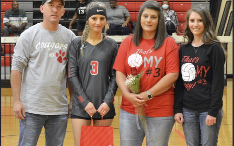 The Copper Basin Lady Cougar volleyball team honored eight seniors during the last home game of the season Thursday, September 23. Shown during the ceremony are, from left, Johnathan Smith, father; senior Gracie Smith; Nakema Smith, mother; and Abby Smith, sister.