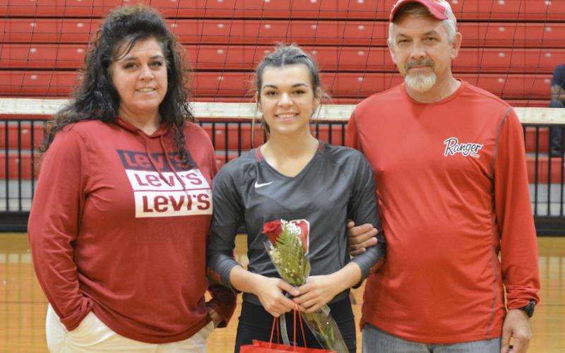 Copper Basin High School recognized eight volleyball seniors during the Lady Cougars last home match of the season. Senior Sydney Hickey is shown during the ceremony with her parents, Patricia and Chuck Hickey.
