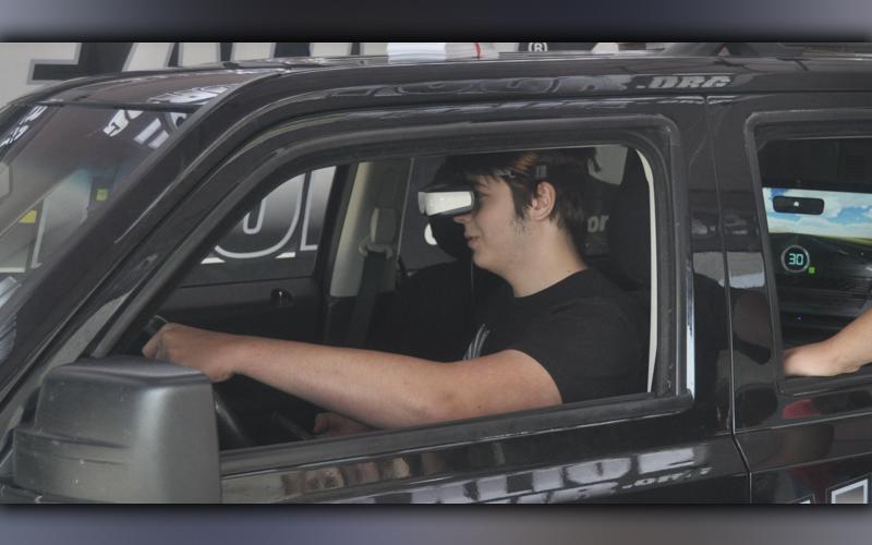 Ian Phillips learns about distracted driving during the Arrive Alive Tour driving simulation at Copper Basin High School Thursday, September 30. The tour is an effort of UNITE, a nationwide health and wellness organization based out of Michigan. The purpose is to give young people a first hand look at the dangers of drunk and distracted driving.
