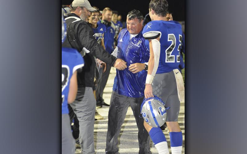 Fannin County High School football head coach Chad Cheatham grins as he received a gatorade bath after the Rebels defeated Chattooga 42-7 to lead Region 7AA. A win Friday, October 29, against Coosa will clinch the Region Championship for the Rebels.