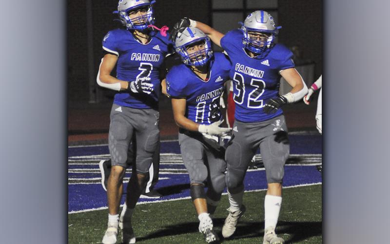 Hayden Lynch (2) celebrates with Austin Garland (18) and Isaac Davis (32) after Garland muscled his way to paydirt on a touchdown run to extend Fannin’s lead over Chattooga Friday, October 22.