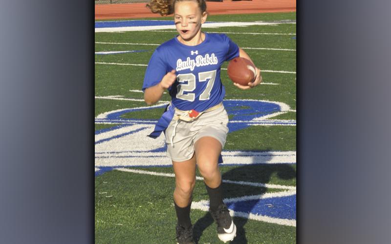 Gracelyn Gray (27) runs into the endzone for a touchdown during the Lady Rebels 33-7 victory over the Lady Tigers Saturday, October 23.