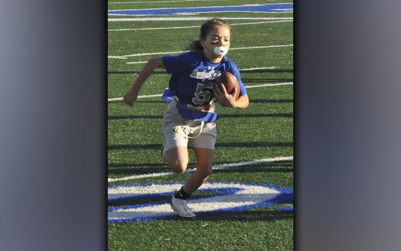 Ryann King (5) breaks off a big gain in the Lady Rebels 33-7 win over the Dawson County Lady Tigers Saturday, October 23.