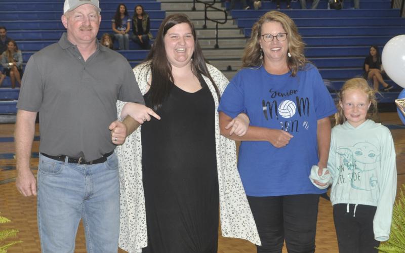 Kalliee Stanley was honored during the Lady Rebels volleyball senior night Tuesday, October 5. Stanley is shown with her “second family” Donnie, Jill and Katelyn Kendall.