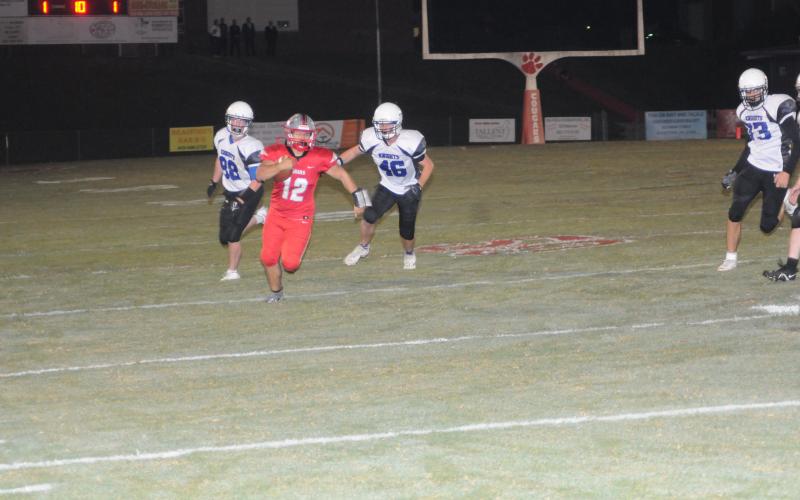 Copper Basin’s Sebastian Baliles outruns two Bradley Knights in football action Friday night. Baliles paced the Cougars’ effort in a 62-0 homecoming win over the Knights. This Friday, the Cougars will travel to Whitwell for a region contest that begins at 7 p.m.