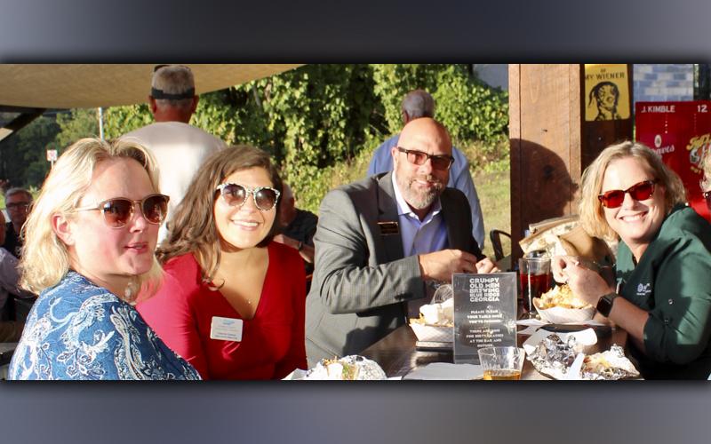 Enjoying tacos from Mountain Tapas at the Fannin County Chamber of Commerce Business After Hours event held at Grumpy Old Men Brewing Tuesday, October 19, are, from left, Lori Baker, Fannin County Development Authority Executive Director Christie Gribble, chamber ambassador Troy Shirbroun with Century 21 and chamber ambassador Shelley Eyerley.
